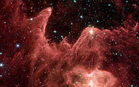 Spitzer Captures Cosmic Mountains of Creation