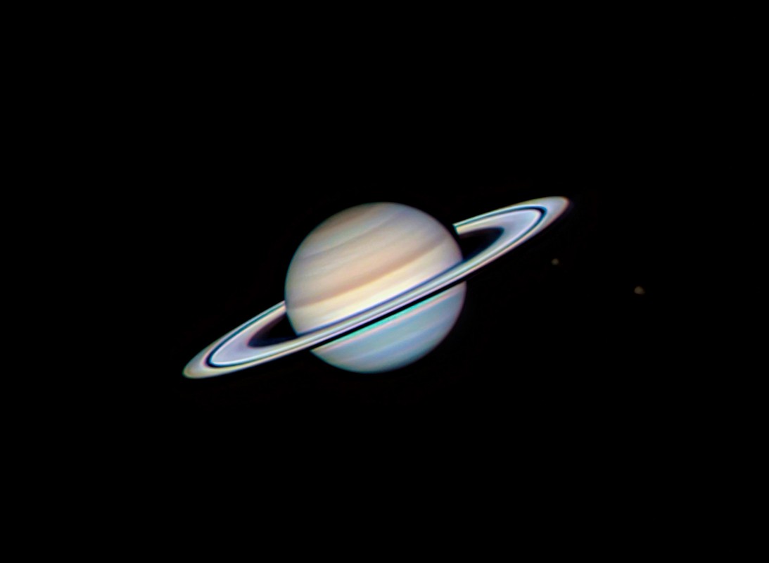 Saturn with moons Tethys and Rhea